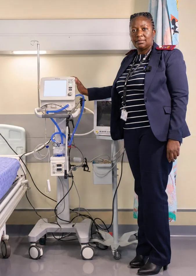 Nursing Services Manager Matron Rambumbulu beside medical equipment donated by Dikuno