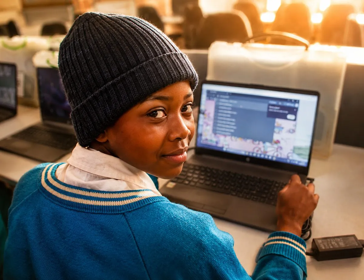 A young learner using a laptop at the Centre