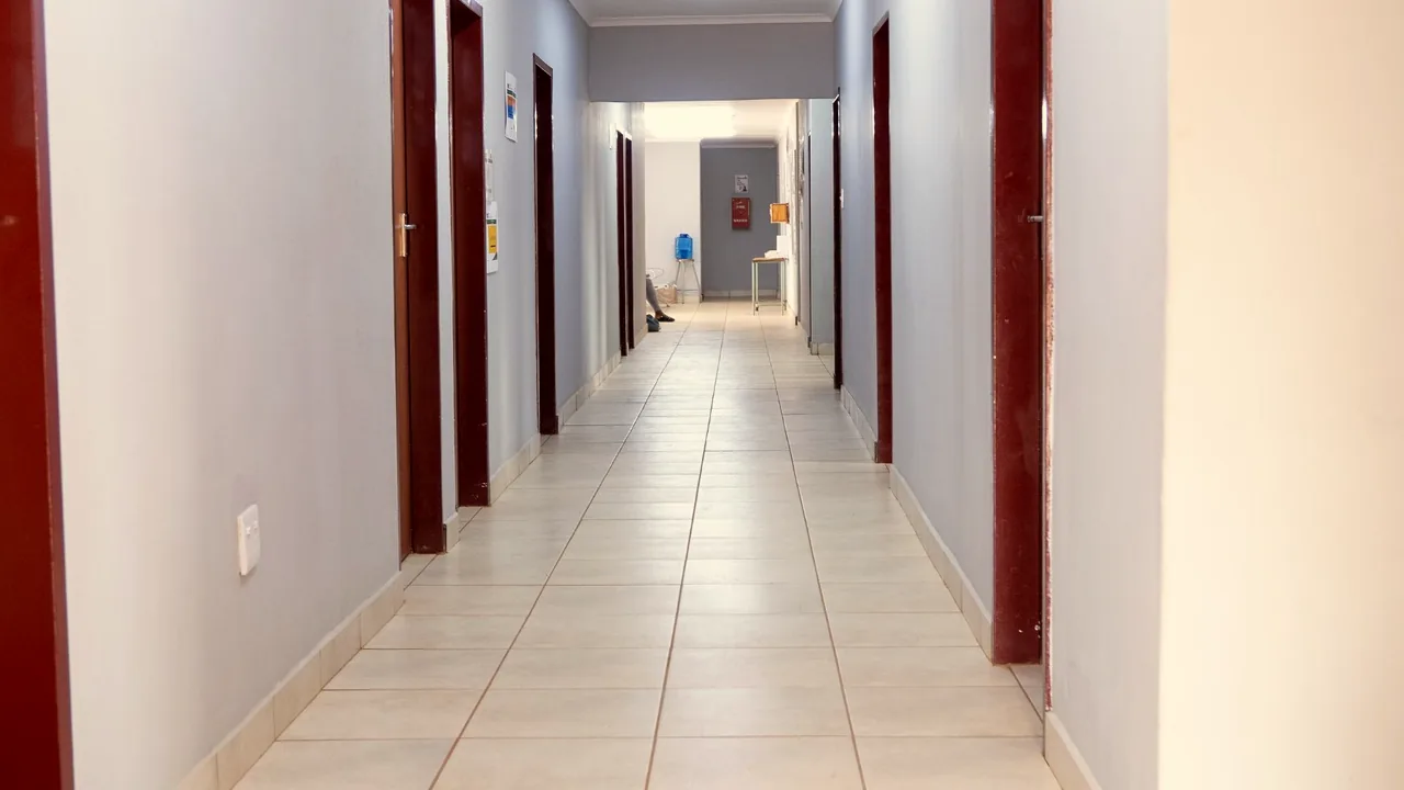 A tiled corridor running through the clinic