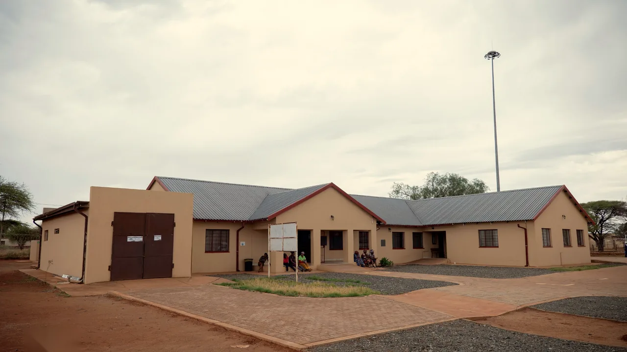 The clinic building seen across the paved forecourt