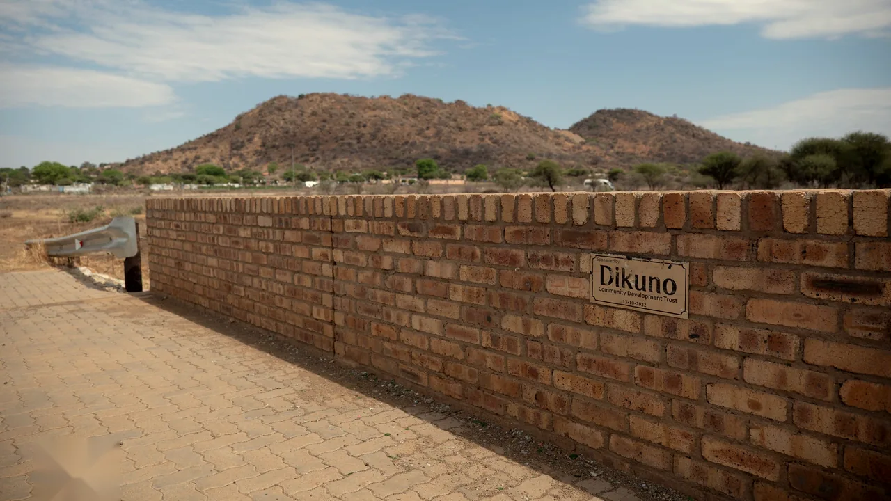 The brick bridge wall with the Dikuno sponsor plaque dated 13 October 2022