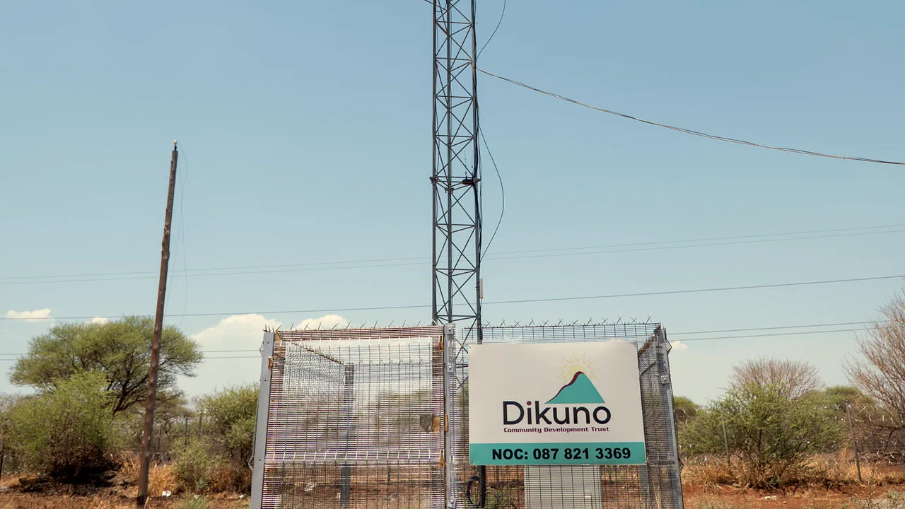 The fenced Wi-Fi tower base with the Dikuno network operations centre sign