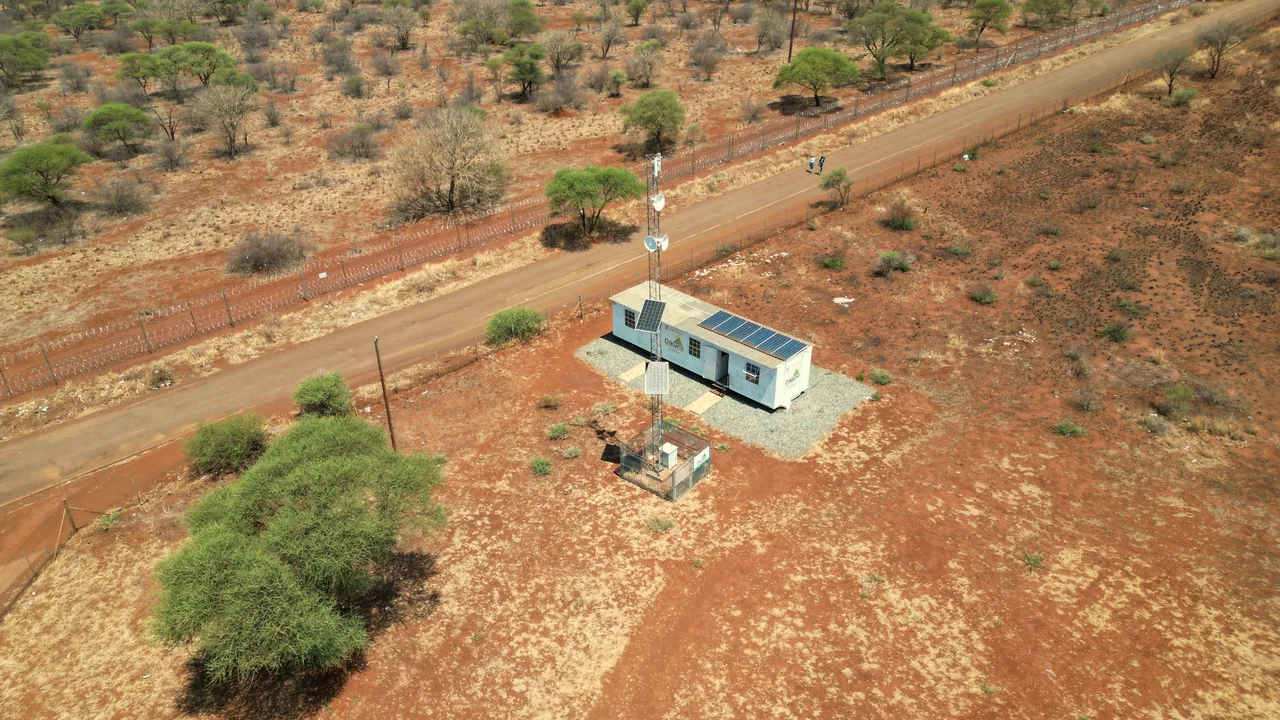 Aerial view of the Wi-Fi hub, tower and solar panels beside the road
